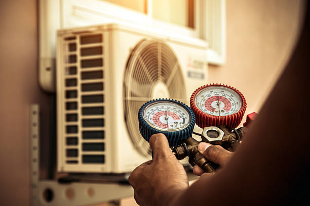 Professional Air Conditioning Service technician working in Cedar Crest, NM